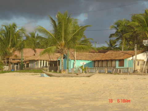 Areia e casas Corumbau